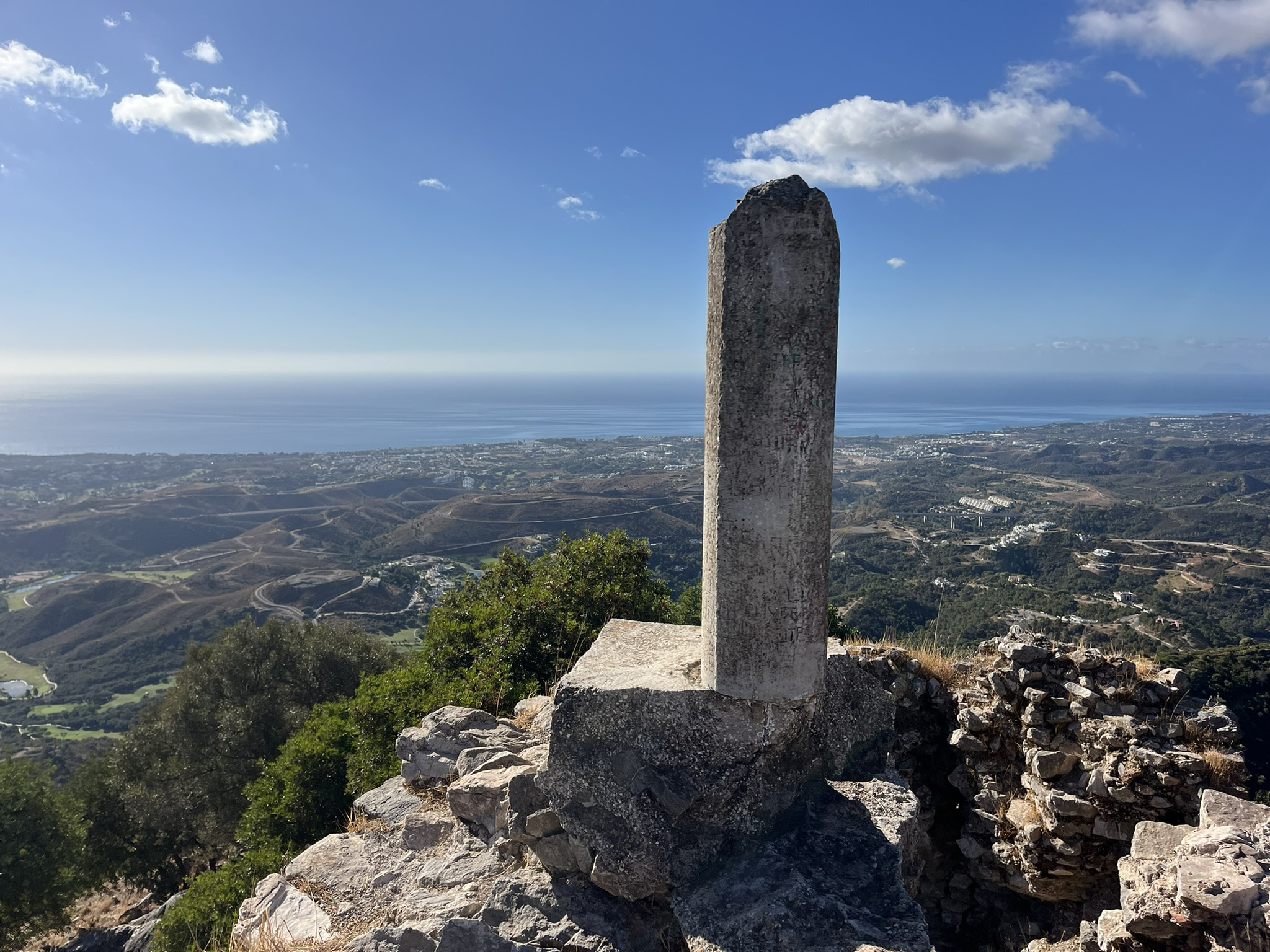 Stone column with coastal views above Benahavís